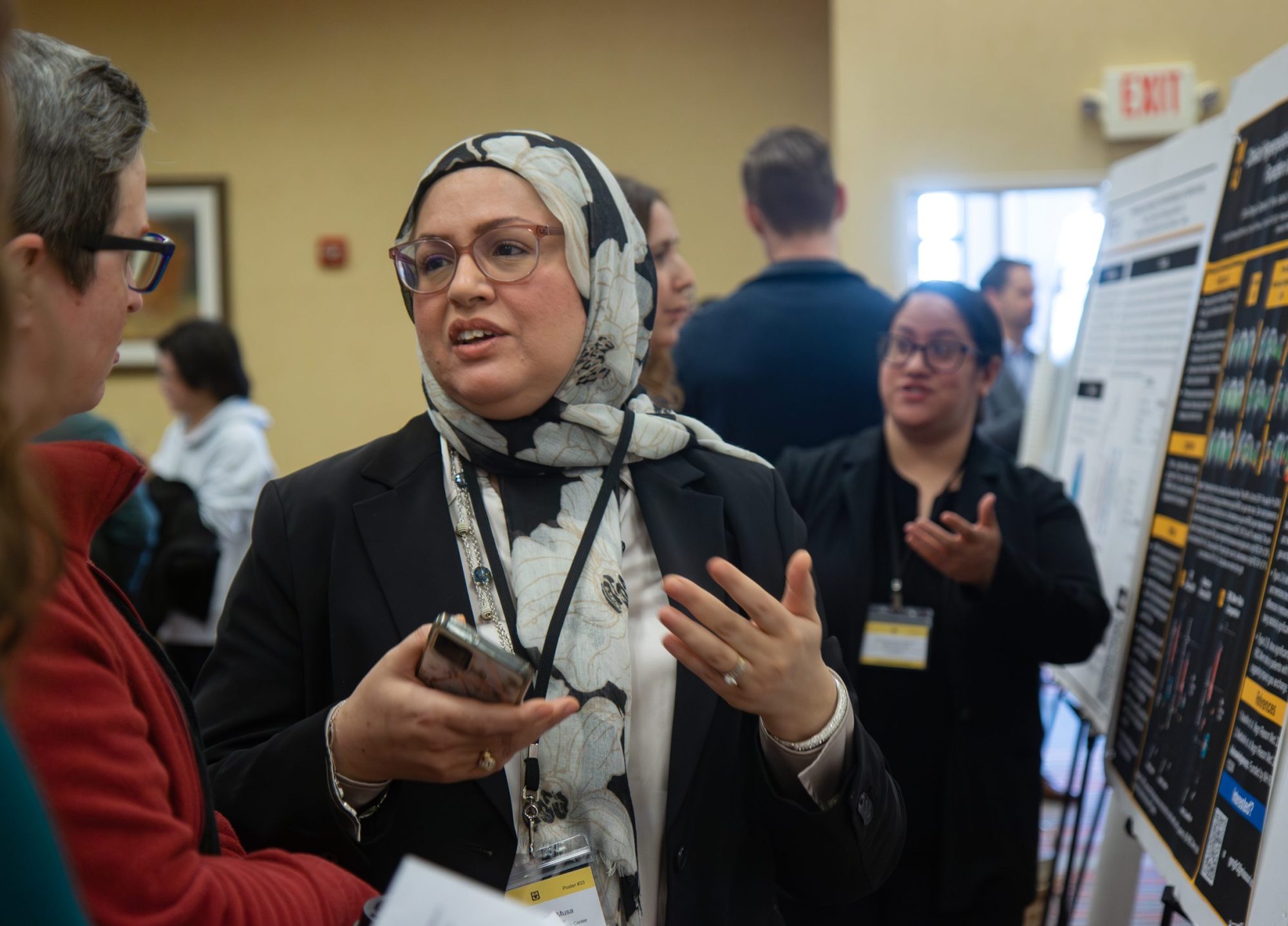 Ruwaida Ben Musa (center) presents her research titled, “Repeated autonomic dysreflexia impairs renal function after spinal cord injury.”
